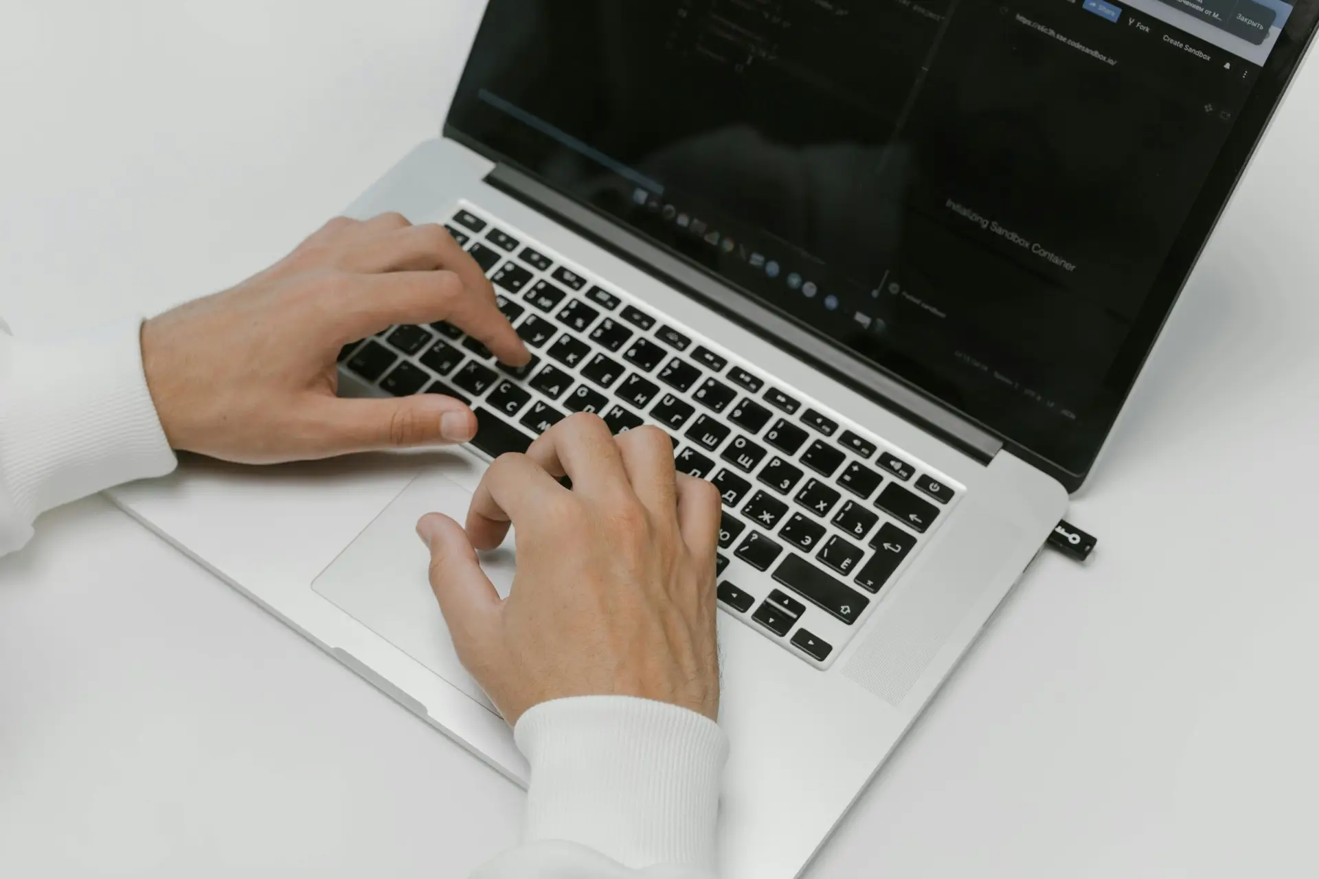 Free Hands on a Laptop Keyboard Stock Photo